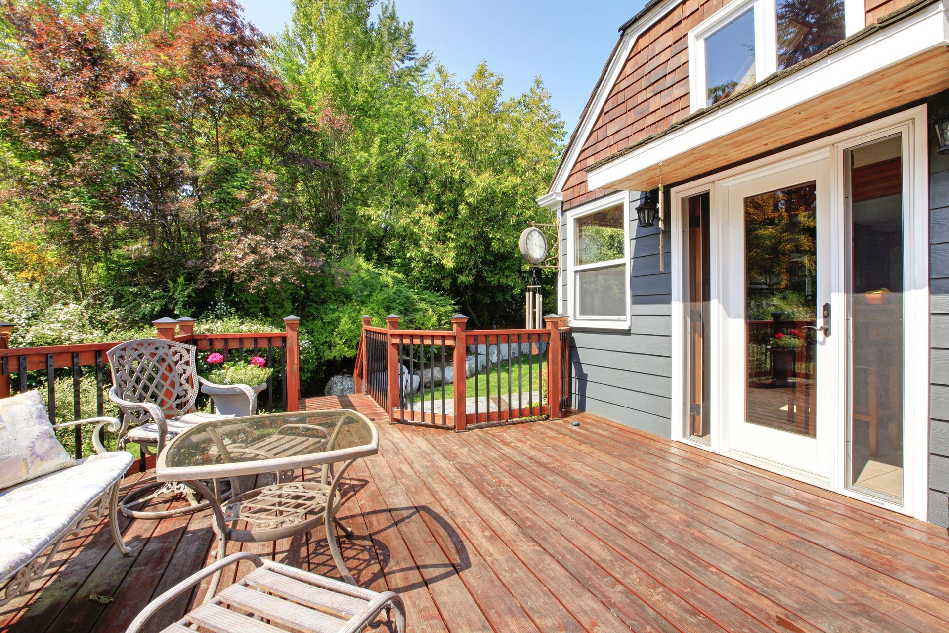 Sliding glass patio door opening onto a back deck